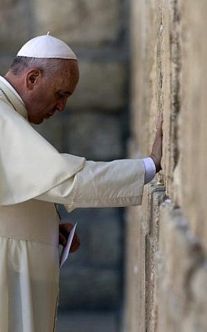 Pope Francis prays at the Western Wall, Judaism's holiest site, in Jerusalem's Old City on May 26, 2014. (photo credit: AFP/Thomas Coex)