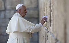 Pope Francis places a prayer between the stones of the Western Wall in Jerusalem's Old City on May 26, 2014. (AFP/Thomas Coex)