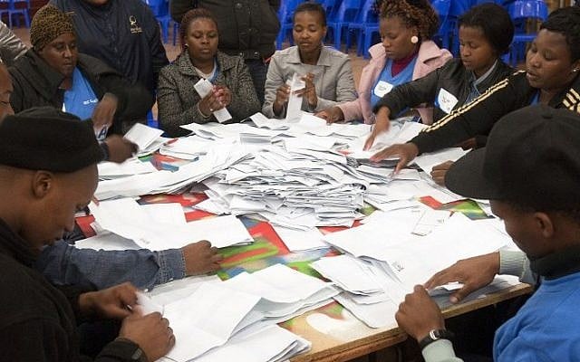 Independent Electoral Commission officials count ballots after voting in South Africa's fifth democratic general election was closed at the Langa polling station in Cape Town on May 7, 2014. (photo credit: AFP/RODGER BOSCH) Independent Electoral Commission officials count ballots after voting in South Africa's fifth democratic general election was closed at the Langa polling station in Cape Town on May 7, 2014. (photo credit: AFP/RODGER BOSCH)