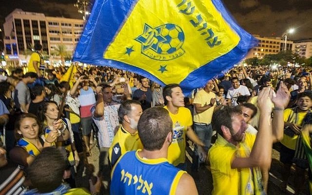 Maccabi Tel Aviv supporters gather in Kikar Rabin (Rabin Square) in Tel Aviv to celebrate the victory of their team after the Euroleague 2014 Final Four basketball match Maccabi Tel Aviv vs Real Madrid, played at Mediolanum Forum in Milan, on May 18, 2014. (photo credit: Jack Guez/AFP) Maccabi Tel Aviv supporters gather in Kikar Rabin (Rabin Square) in Tel Aviv to celebrate the victory of their team after the Euroleague 2014 Final Four basketball match Maccabi Tel Aviv vs Real Madrid, played at Mediolanum Forum in Milan, on May 18, 2014. (photo credit: Jack Guez/AFP)