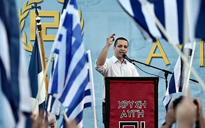Spokesman of the Greek ultra nationalist party Golden Dawn Iias Kasidiaris delivers a speech during a pre-election rally in Athens on May 23, 2014 (photo credit: AFP/ARIS MESSINIS)