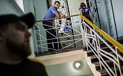 An Ukrainian policeman stands guard at a polling station in Krasnoarmiisk, in the Donetsk province, eastern Ukraine, on May 24, 2014, one day ahead of the presidential elections. (photo credit: AFP Photo/Fabio Bucciarelli)