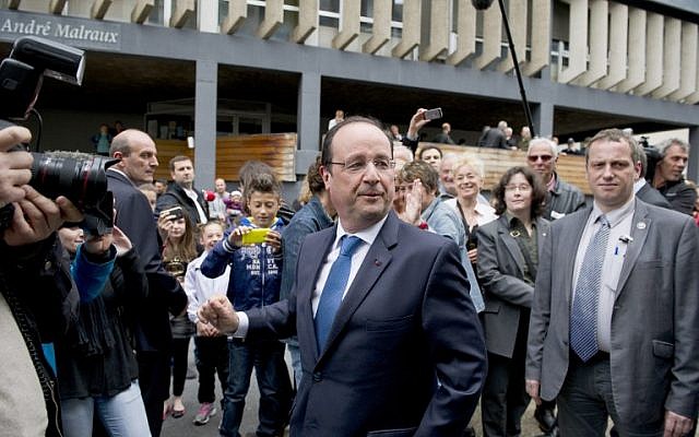 French President Francois Hollande (C) leaves a polling station after casting his ballot for the European Parliament elections on May 25, 2014 in Tulle, centralwestern France. (photo credit: AFP PHOTO/ ALAIN JOCARD) French President Francois Hollande (C) leaves a polling station after casting his ballot for the European Parliament elections on May 25, 2014 in Tulle, centralwestern France. (photo credit: AFP PHOTO/ ALAIN JOCARD)