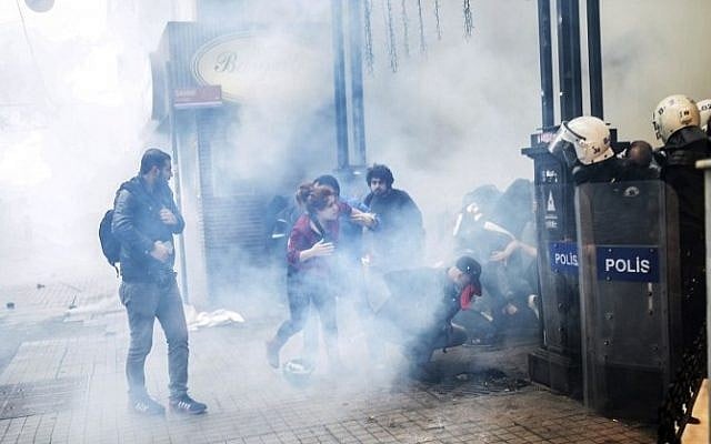 Turkish riot police use tear gas to disperse protesters gathered on the central Istoklal avenue near Taksim square in Istanbul, on May 31, 2014 (photo credit: AFP/BULENT KILIC)