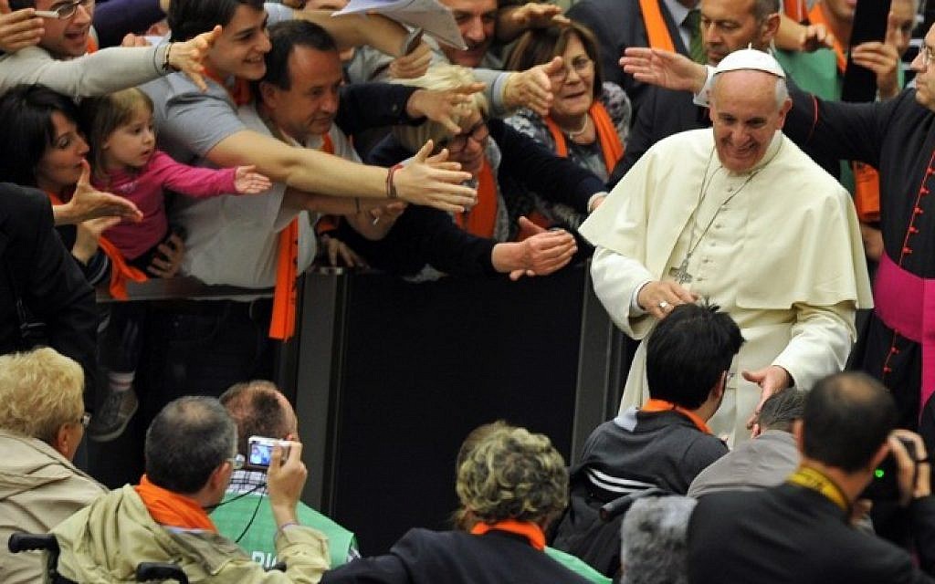 Pope Francis greets people during a meeting with members of the associations founded by Blessed Luigi Novarese at Paul VI audience hall on May 17, 2014 at the Vatican. (Photo credit: AFP Photo/Tiziana Fabi) Pope Francis greets people during a meeting with members of the associations founded by Blessed Luigi Novarese at Paul VI audience hall on May 17, 2014 at the Vatican. (Photo credit: AFP Photo/Tiziana Fabi)