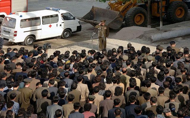 A North Korean construction division officer (top) apologizes to residents following a serious accident in the construction site of an apartment house in Phyongchon District, Pyongyang on May 13. (photo credit: AFP PHOTO / KCNA via KNS REPUBLIC OF KOREA) A North Korean construction division officer (top) apologizes to residents following a serious accident in the construction site of an apartment house in Phyongchon District, Pyongyang on May 13. (photo credit: AFP PHOTO / KCNA via KNS REPUBLIC OF KOREA)