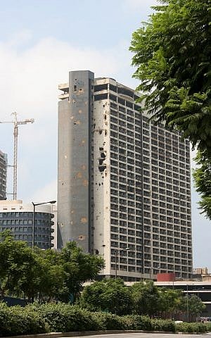 The old Holiday Inn in Beirut clearing showing the extensive damage it suffering during the Lebanese Civil War. (photo credit: CC BY SA Giorgio Montersino/Flickr)
