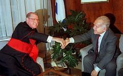 New York's Cardinal John J. O'Connor shakes hands with Israeli prime minister Yitzhak Shamir during a meeting in Jerusalem, Jan. 5, 1992. (photo credit: AP Photo)