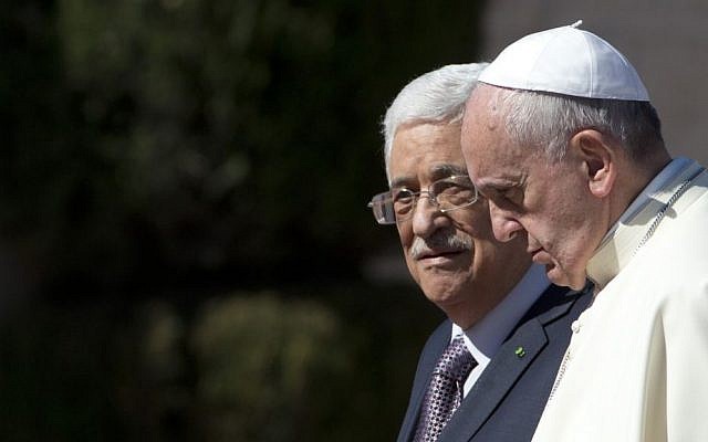Pope Francis is welcomed by Palestinian Authority President Mahmoud Abbas upon his arrival to the West Bank city of Bethlehem, Sunday, May 25, 2014. (AP Photo/Andrew Medichini)
