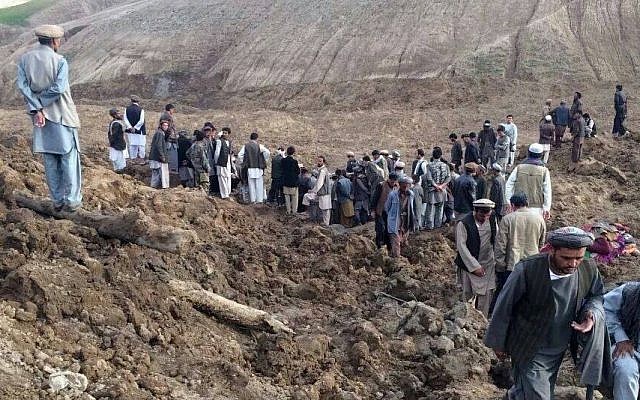In this photo provided by Homayoon Rahmani, the chief of road reconstruction program in the Afghan Rural and Rehabilitation Development Ministry, Afghans search for survivors after a massive landslide landslide buried a village Friday, May 2, 2014 in Badakhshan province, northeastern Afghanistan, which Afghan and UN officials say left hundreds of dead and missing missing. (Photo credit: AP/Homayoon Rahmani) In this photo provided by Homayoon Rahmani, the chief of road reconstruction program in the Afghan Rural and Rehabilitation Development Ministry, Afghans search for survivors after a massive landslide landslide buried a village Friday, May 2, 2014 in Badakhshan province, northeastern Afghanistan, which Afghan and UN officials say left hundreds of dead and missing missing. (Photo credit: AP/Homayoon Rahmani)