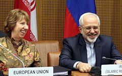 European Foreign Policy Chief Catherine Ashton (left), and Iranian Foreign Minister Mohammad Javad Zarif (right), before the closed-door nuclear talks in Vienna, Austria, on Wednesday, May 14, 2014. (photo credit: AP/Ronald Zak)