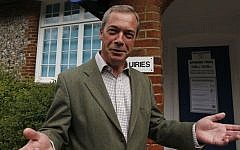 Nigel Farage, leader of Britain's United Kingdom Independence Party (UKIP) poses for the media before voting for the European Parliament in Cudham, England, on Thursday, May 22, 2014. (photo credit: AP/Lefteris Pitarakis)