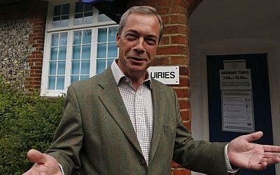 Nigel Farage, leader of Britain's United Kingdom Independence Party (UKIP) poses for the media before voting for the European Parliament in Cudham, England, on Thursday, May 22, 2014. (photo credit: AP/Lefteris Pitarakis)