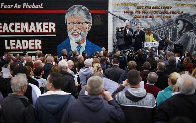 Sinn Fein's Martin McGuinness, center, with party members Bobby Storey, left, and Martina Anderson speak during a protest rally on the Falls Road, West Belfast, Northern Ireland, Saturday, May, 3, 2014 (photo credit: AP/Peter Morrison) Sinn Fein's Martin McGuinness, center, with party members Bobby Storey, left, and Martina Anderson speak during a protest rally on the Falls Road, West Belfast, Northern Ireland, Saturday, May, 3, 2014 (photo credit: AP/Peter Morrison)