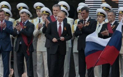 Vladimir Putin, center, is greeted by spectators (unseen) after speaking at a gala concert marking Victory Day in Sevastopol, Crimea, in May 2014. (photo credit: AP/Ivan Sekretarev)
