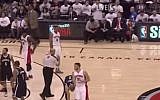 Drake cleans lint off his pants ringside. (YouTube screenshot)