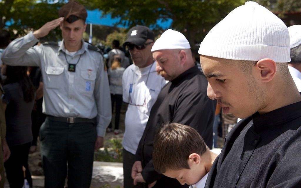 A Druze family stands silent during a Memorial Day ceremony at the military cemetery of Ussefiya on Mount Carmel, April 2010 (photo credit: Matanya Tausig/Flash90) A Druze family stands silent during a Memorial Day ceremony at the military cemetery of Ussefiya on Mount Carmel, April 2010 (photo credit: Matanya Tausig/Flash90)