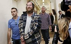 Elchana Finar, one of the Jewish settlers arrested for destroying an IDF outpost in the West Bank settlement of Yitzhar, following the demolition of illegal structures in the settlement, seen brought to Magistrates Court in Tel Aviv, on April 10, 2014. (photo credit: Miriam Alster/Flash90)