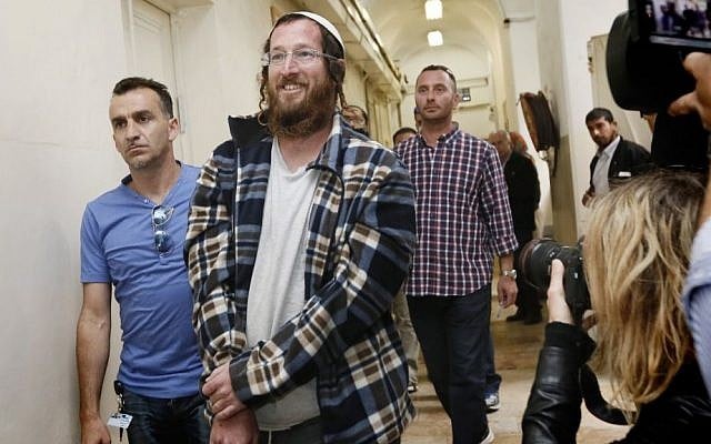 Elchana Finar, one of the Jewish settlers arrested for destroying an IDF outpost in the West Bank settlement of Yitzhar, following the demolition of illegal structures in the settlement, seen brought to Magistrates Court in Tel Aviv, on April 10, 2014. (photo credit: Miriam Alster/Flash90) Elchana Finar, one of the Jewish settlers arrested for destroying an IDF outpost in the West Bank settlement of Yitzhar, following the demolition of illegal structures in the settlement, seen brought to Magistrates Court in Tel Aviv, on April 10, 2014. (photo credit: Miriam Alster/Flash90)