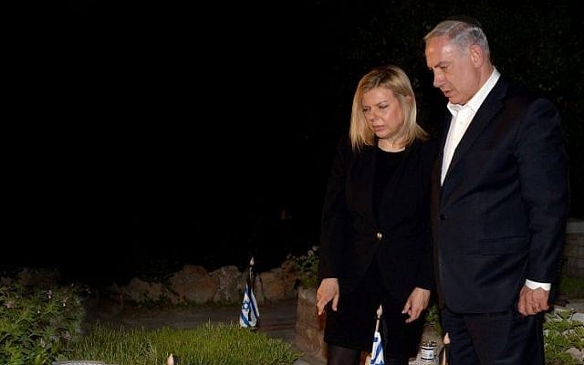 Prime Minister Benjamin Netanyahu and his wife Sara seen next to the grave of PM Netanyahu's late brother Yoni at the Mt Herzl military cemetery in Jerusalem, on the eve before Israeli Memorial Day. (photo credit: Haim Zach/GPO/Flash90) Prime Minister Benjamin Netanyahu and his wife Sara seen next to the grave of PM Netanyahu's late brother Yoni at the Mt Herzl military cemetery in Jerusalem, on the eve before Israeli Memorial Day. (photo credit: Haim Zach/GPO/Flash90)