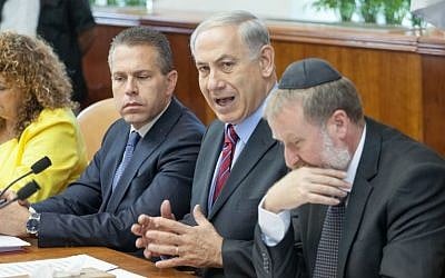 Minister of Communications Gilad Erdan (L), Prime Minister Benjamin Netanyahu (C) and cabinet secretary Avichai Mandelblit seen at the weekly cabinet meeting at Prime Minister Netanyahu's office in Jerusalem, May 04, 2014. (Photo credit: Emil Salman/POOL/FLASH90) 