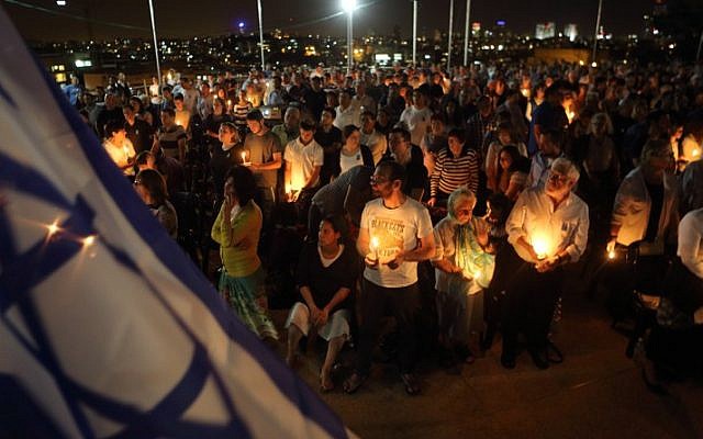 Ultra-Orthodox Jews hold candles as they take part at a memorial ceremony commemorating the fallen Israeli soldiers, on the eve of Israeli Memorial Day in the city of Bnei Brak on Sunday, May 4, 2014. (Photo credit: Yaakov Naumi/Flash90) Ultra-Orthodox Jews hold candles as they take part at a memorial ceremony commemorating the fallen Israeli soldiers, on the eve of Israeli Memorial Day in the city of Bnei Brak on Sunday, May 4, 2014. (Photo credit: Yaakov Naumi/Flash90)