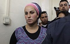 Eliraz Fein, a 22-year-old Israeli settler from the northern West Bank settlement of Yitzhar, is brought to court in suspicion of "inciting violence against soldiers" on May 7, 2014. (Meital Cohen/Flash90)