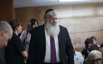 Eli Simhayoff arrives to the District Court in Tel Aviv to receive his sentence in the Holyland trial May 13, 2014. (Photo credit: Yotam Ronen/POOL/Flash90)