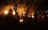 Ultra-Orthodox Jews gather around the bonfire during celebrations of the Jewish holiday of Lag B'Omer in the ultra-Orthodox city of Bnei Brak, outside of Tel Aviv, on May 17, 2014. (photo credit: Yaakov Naumi/Flash90)