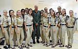 Defense Minister Moshe Ya'alon (center) stands with Israeli soldiers at the Palmachim Air Base on Tuesday while visiting the Arrow II unit stationed there. Ya'alon warned the budget crisis could harm Israel's missile defenses. (photo credit: Ariel Hermoni/Ministry of Defense/Flash90)