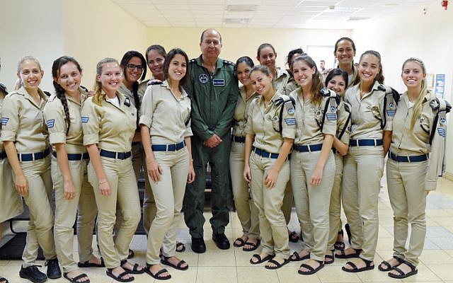 Defense Minister Moshe Ya'alon (center) stands with Israeli soldiers at the Palmachim Air Base on Tuesday while visiting the Arrow II unit stationed there. Ya'alon warned the budget crisis could harm Israel's missile defenses. (photo credit: Ariel Hermoni/Ministry of Defense/Flash90) Defense Minister Moshe Ya'alon (center) stands with Israeli soldiers at the Palmachim Air Base on Tuesday while visiting the Arrow II unit stationed there. Ya'alon warned the budget crisis could harm Israel's missile defenses. (photo credit: Ariel Hermoni/Ministry of Defense/Flash90)