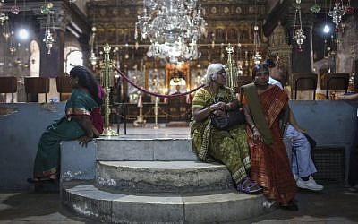 Christian pilgrims seen inside the Church of the Nativity, in Bethlehem, on May 21, 2014. (photo credit: Hadas Parush/Flash90)
