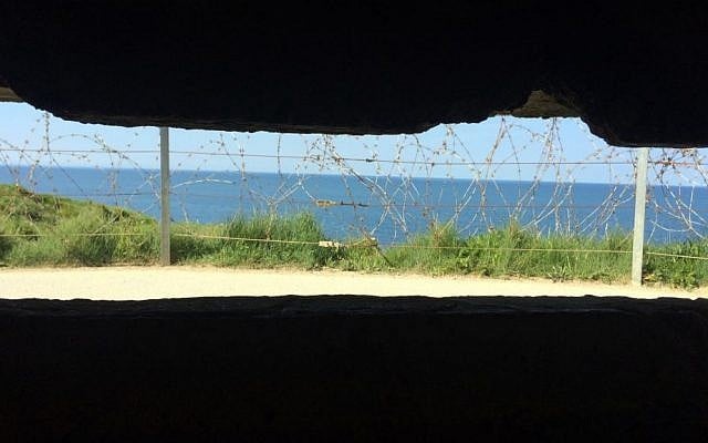 In this photo dated May 15, 2014, the Pointe du Hoc is seen from inside a German bunker in Cricqueville en Bessin, in Normandy, France. (AP Photo/Nicolas Garriga) 