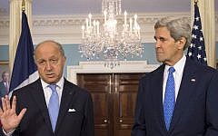 Secretary of State John Kerry listens as French Foreign Minister Laurent Fabius speaks prior to their meeting at the State Department in Washington, Tuesday, May 13, 2014. (photo credit: AP Photo/Molly Riley)