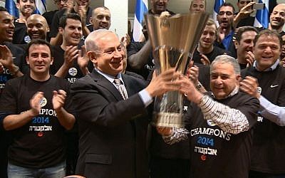 Israeli Prime Minister Benjamin Netanyahu congratulates the Israeli basketball team Maccabi Tel Aviv on May 19, 2014. Maccabi Tel Aviv won the Europe Cup in basketball with a score of 86-98 against Real Madrid, last night. (photo credit: Haim Zach/GPO/Flash90) Israeli Prime Minister Benjamin Netanyahu congratulates the Israeli basketball team Maccabi Tel Aviv on May 19, 2014. Maccabi Tel Aviv won the Europe Cup in basketball with a score of 86-98 against Real Madrid, last night. (photo credit: Haim Zach/GPO/Flash90)