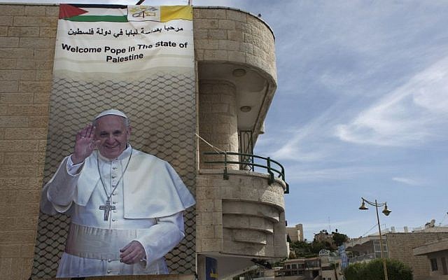 In this photo taken Monday, May 19, 2014, a welcome banner for Pope Francis with his picture hangs on a building in the West Bank city of Bethlehem. (photo credit: AP/Nasser Nasser) In this photo taken Monday, May 19, 2014, a welcome banner for Pope Francis with his picture hangs on a building in the West Bank city of Bethlehem. (photo credit: AP/Nasser Nasser)