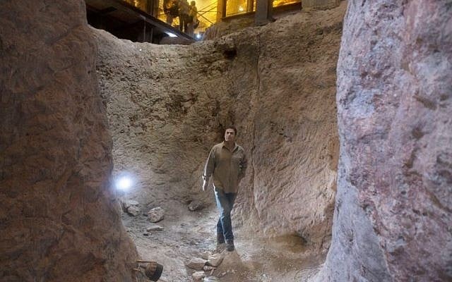 Archaeologist Eli Shukron, who claims to uncovered the citadel captured from the Jebusites by King David, walks in the City of David archaeological site near Jerusalem's Old City on Thursday, May 1, 2014. (AP Photo/Sebastian Scheiner)