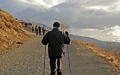 This Dec. 6, 2013 file image posted on his official Instagram account shows Iranian President Hassan Rouhani hiking in the Tochal mountain area north of Tehran, Iran. (photo credit: AP/Office of Hassan Rouhani via Instagram/File)