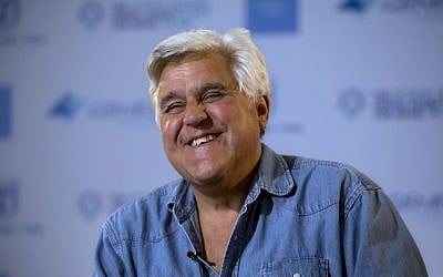 American comedian Jay Leno reacts during an interview with the Associated Press in Jerusalem, May 21, 2014. (AP/Sebastian Scheiner)