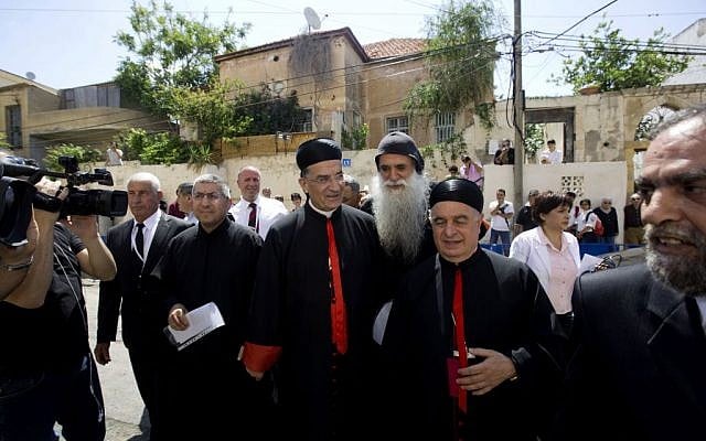 Cardinal Bechara Rai, head of the Maronite Catholic Church, center, arrives to visit a church in Jaffa, a mixed Jewish and Arab neighborhood in Tel Aviv, Israel, Monday, May 26, 2014. (photo credit: AP Photo/Sebastian Scheiner) Cardinal Bechara Rai, head of the Maronite Catholic Church, center, arrives to visit a church in Jaffa, a mixed Jewish and Arab neighborhood in Tel Aviv, Israel, Monday, May 26, 2014. (photo credit: AP Photo/Sebastian Scheiner)