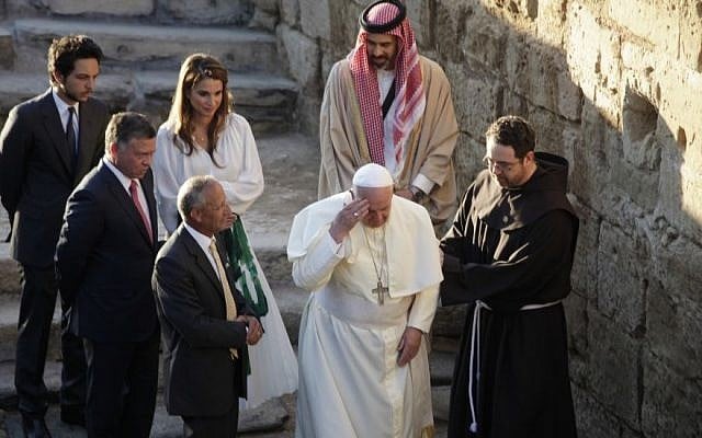 Pope Francis, center, makes the sign of the cross at the holy water at the Bethany beyond the Jordan, which many believe is the traditional site of Jesus' baptism, in South Shuna, west of Amman, Jordan, Saturday, May 24, 2014. (Photo credit: AP/Mohammad Hannon) Pope Francis, center, makes the sign of the cross at the holy water at the Bethany beyond the Jordan, which many believe is the traditional site of Jesus' baptism, in South Shuna, west of Amman, Jordan, Saturday, May 24, 2014. (Photo credit: AP/Mohammad Hannon)