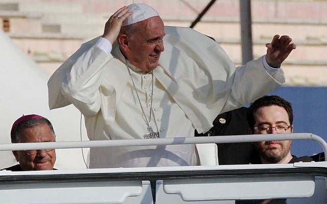 Pope Francis waves at audience members after his arrival at Amman's international stadium in Jordan, Saturday, May 24, 2014. (Photo credit: AP/Raad Adayleh) Pope Francis waves at audience members after his arrival at Amman's international stadium in Jordan, Saturday, May 24, 2014. (Photo credit: AP/Raad Adayleh)