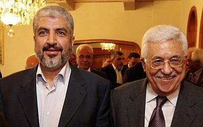 In this file photo provided on Nov. 24, 2011, by the office of Khaled Mashaal, Palestinian Hamas leader Khaled Mashaal, left, and Palestinian Authority President Mahmoud Abbas are seen together during their meeting in Cairo, Egypt. (Photo credit: AP/Office of Khaled Meshaal, File)
