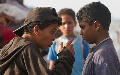 This image released by Kino Lorber, Inc. shows Said El Alami, left, and Achraf Afir in a scene from 'Horses of God.' The film, directed by Nabil Ayouch, follows the path of four Moroccan men from the Sidi Moumen slum as they become suicide bombers. (AP Photo/Kino Lorber, Inc.)