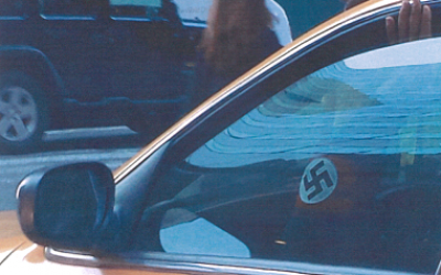 Gabriel Diaz's swastika armband is seen through the window of his cab (photo credit: ADL/JTA)