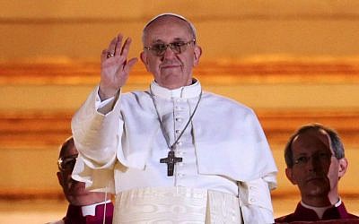 Pope Francis I waving to the crowds on the central balcony of St. Peter's Basilica in Vatican City, on March 13, 2013. (Peter Macdiarmid/Getty/via JTA)