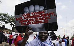 A woman attends a demonstration in Lagos, Nigeria, on Monday, May 5, 2014, urging the government to increase efforts to rescue hundreds of abducted female students from a government secondary school. (photo credit: AP/Sunday Alamba)