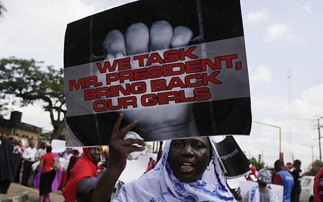 A woman attends a demonstration in Lagos, Nigeria, on Monday, May 5, 2014, urging the government to increase efforts to rescue hundreds of abducted female students from a government secondary school. (photo credit: AP/Sunday Alamba) A woman attends a demonstration in Lagos, Nigeria, on Monday, May 5, 2014, urging the government to increase efforts to rescue hundreds of abducted female students from a government secondary school. (photo credit: AP/Sunday Alamba)