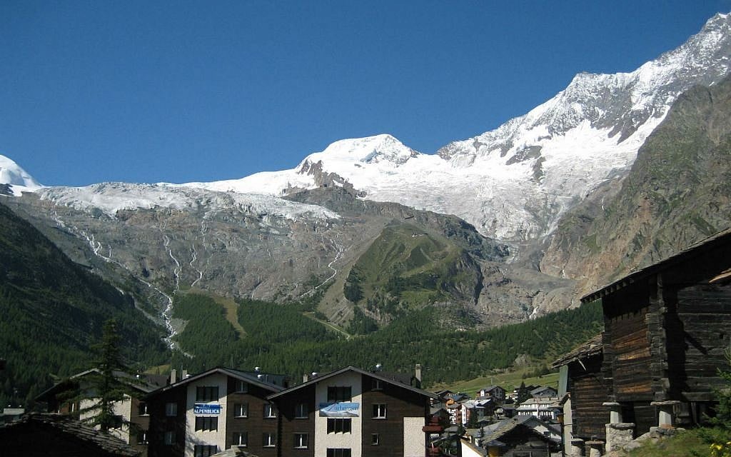A glance at the Swiss town of Saas Fee in the summer, when the mountains are still covered with snow, but the lower reaches are green and verdant (Courtesy Saas Fee Tourist Office) A glance at the Swiss town of Saas Fee in the summer, when the mountains are still covered with snow, but the lower reaches are green and verdant (Courtesy Saas Fee Tourist Office)
