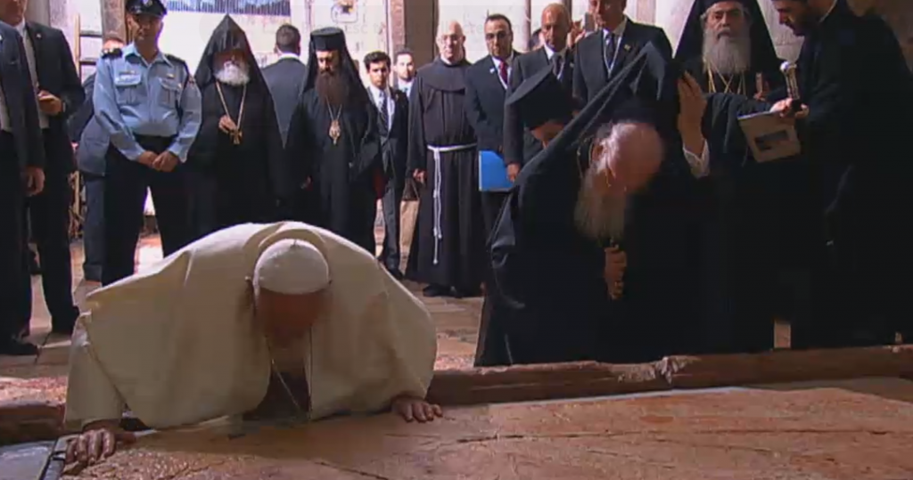 Pope Francis and Bartholomew I kiss the Stone of Unction in the Church of the Holy Sepulchre in 2014 (screen capture: GPO) Pope Francis and Bartholomew I kiss the Stone of Unction in the Church of the Holy Sepulchre in 2014 (screen capture: GPO)